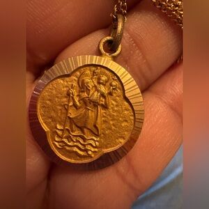 Vintage gold tone medallion.
